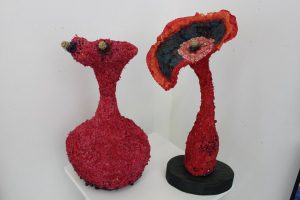 Two abstract red textured sculptures at the Christmas 2016 group show at the Outlaw Gallery