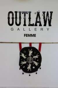 Femme group show logo and fabric artwork at the Outlaw Gallery