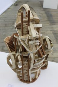 A complex wooden sculpture at the 'Just Tuesdays' group show at the Outlaw Gallery