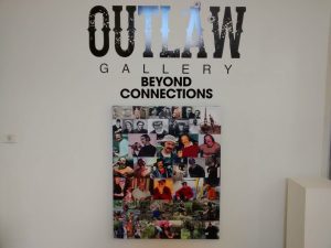 Signs for the group exhibition 'Beyond Connections' with a collection of photos of Jack Wilkins
