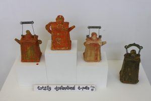 Four ceramic teapots