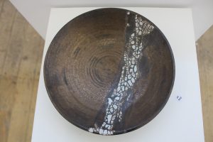 A brown and white ceramic plate