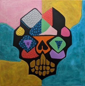 A graffiti-style painting of a multicoloured skull on a colourful wall by artist Sam Ward.